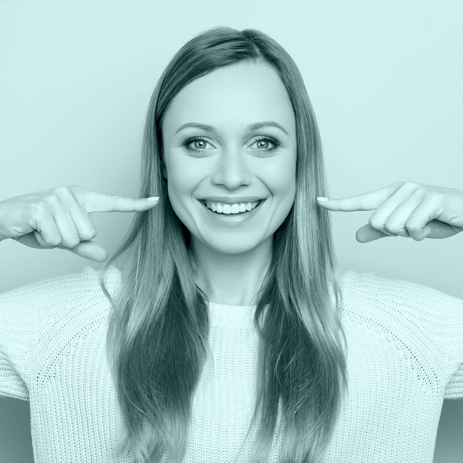 image of a girl pointing at her teeth smiling